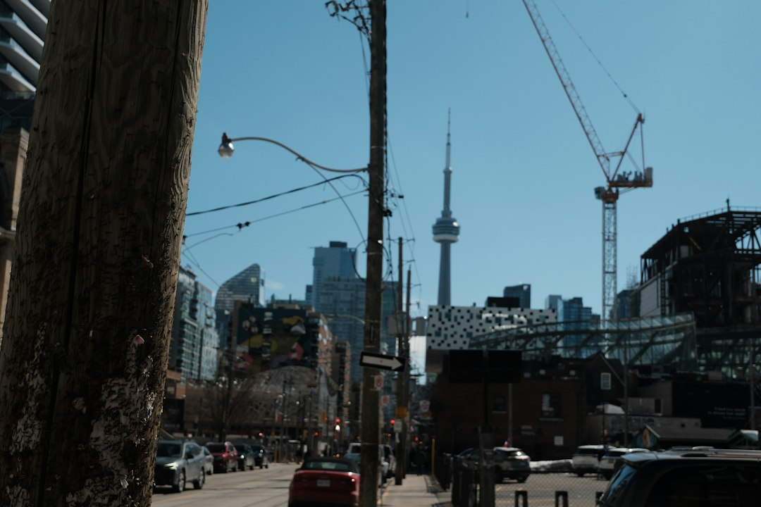 Construction cranes over the Toronto skyline, representing major infrastructure investment and jobs in Canada
