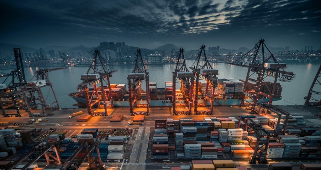 Transportation & Supply Chain Careers in Canada: Jobs, Pay, Skills and Projects Container ship being loaded at a freight port, illustrating Canadian marine logistics and port careers