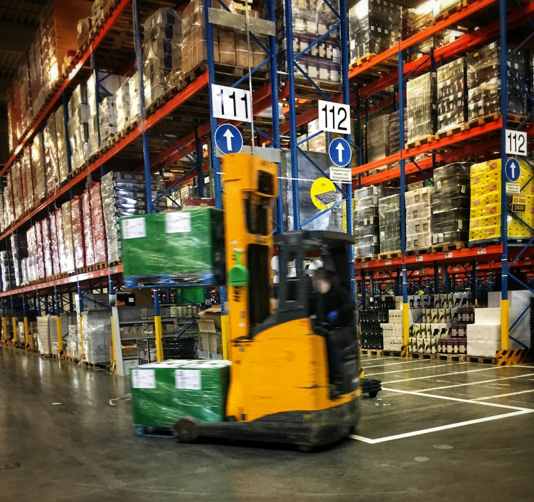 Forklift moving pallets in a warehouse, illustrating Canadian warehousing and supply chain operations careers