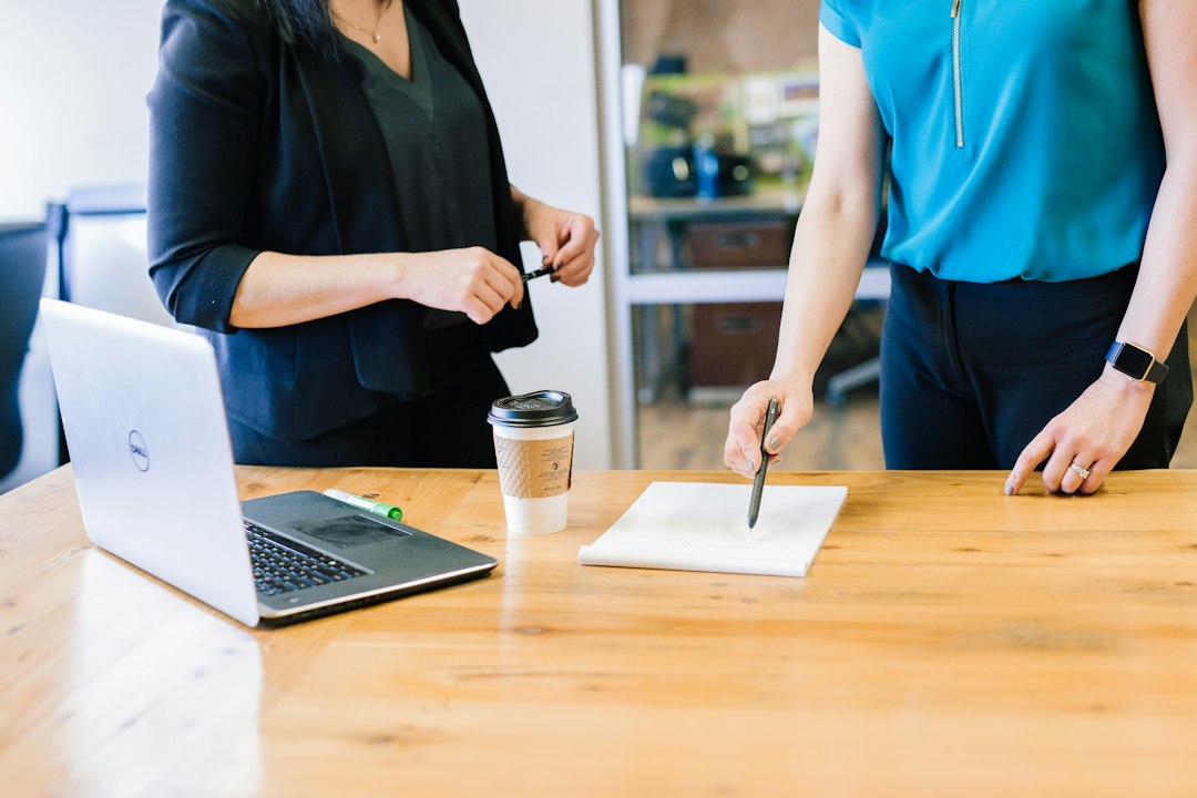 Professional reviewing a job offer and salary range at a desk