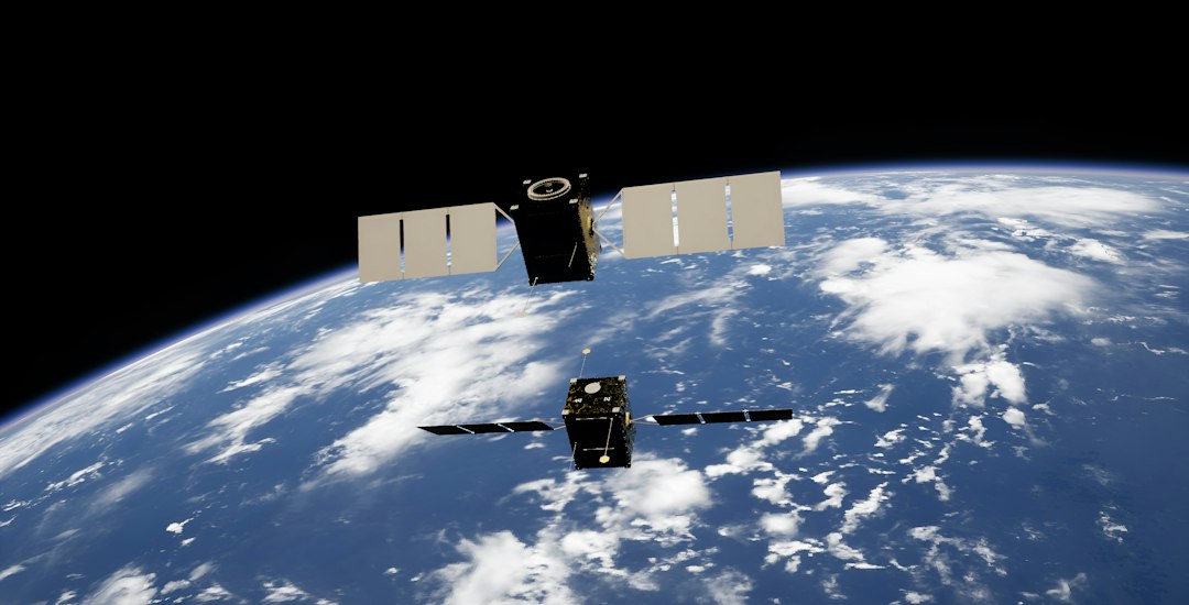 Two satellites illustrated above Earth representing Canadian space systems careers